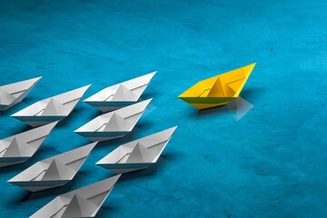 preceptor - Leadership, success, and teamwork concept, yellow leader paper boat leading white followers boats