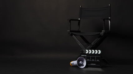 Black director chair and Clapper board or movie Clapperboard with megaphone on black background.use...