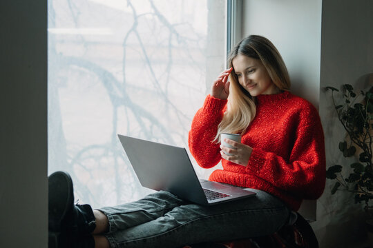 Woman using online dating app on laptop. Valentines Day, dating, meeting During The Coronavirus Outbreak. Love at distance in the time of coronavirus.