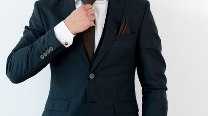Obraz na płótnie Canvas Businessman Adjust Necktie of his Suit