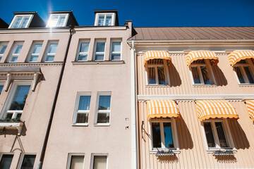 Fototapeta premium Facade of two scenic vintage houses in Finland