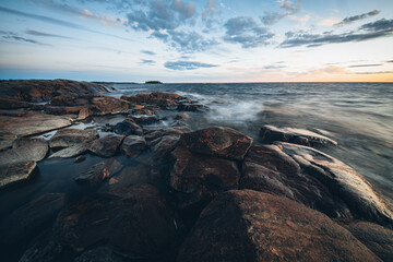 Scenic Sunset on the rocky beach of Faboda, Finland