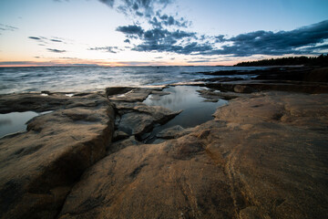 sunset over rocky coast of Faboda, Finland