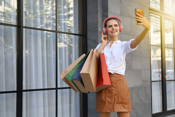 Beautiful lady woman relax walking on shopping street and feeling cheerful posing and happy holiday sale and selfie take a picture