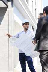 Business team people meeting and talking with engineer and architecture about planning and drawing of building construction project, smart executive professional working at outdoor