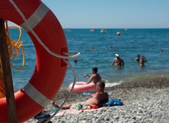 Red lifebuoy on the background of the sea