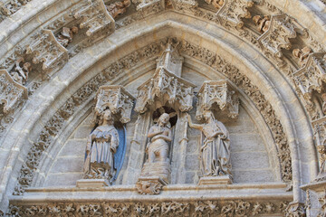 Obraz premium Door of Baptism, Seville Cathedral, Spain. The Door of Baptism was built in the 15th century and decorated with a scene depicting the baptism of Jesus.