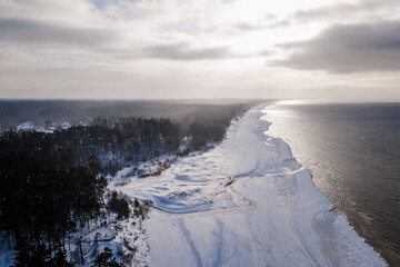 Scenic sunset over a snowy winter beach