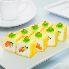 Bright colored sushi with salmon, cucumber and caviar