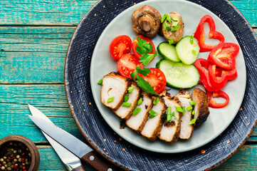 Cutting meat steak with vegetables