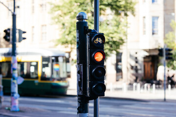 traffic light on the street with red light glowing