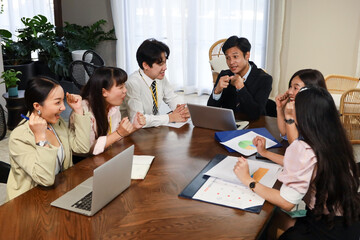 Young business people talking and discussing with coworker team while group meeting and handshake agreement in conference room