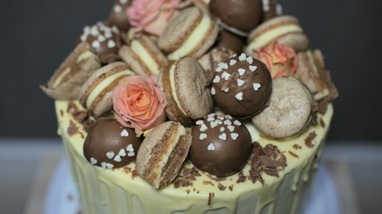 White cheese glaze cake with cookies on top.