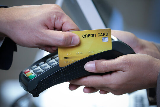 Businessman using credit card for purchase and payment something service by electronic machine internet banking reader