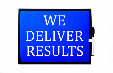 On a blue background a white inscription WE DELIVER RESULTS