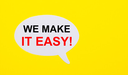 On a bright yellow background, white paper with the words WE MAKE IT EASY