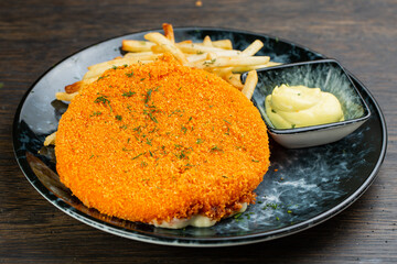 deep-fried breaded cheese with fries and gritsa sauce