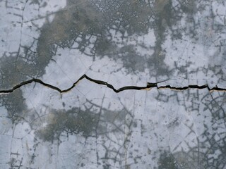 The ground was cracked because of being hit.