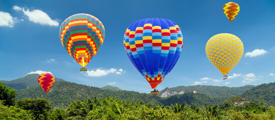Hot air balloons landing in a mountain