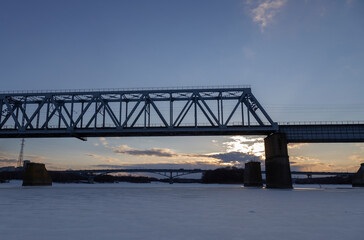 railway bridge winter. Railway bridge over the river. Steel structure, railway.