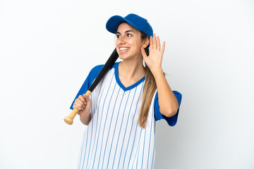 Young caucasian woman playing baseball isolated on white background listening to something by putting hand on the ear