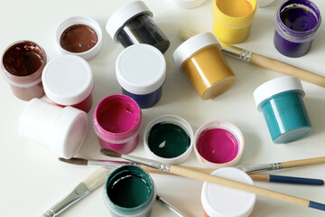 top view of painting tool, gouaches and painting brushes