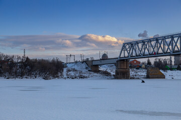 railway bridge winter. Railway bridge over the river. Steel structure, railway.