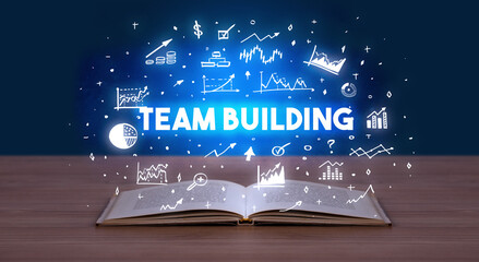 TEAM BUILDING inscription coming out from an open book, business concept