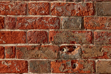 The texture of an old red  brick wall. Close-up, pattern.