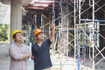 Two engineers working in a construction site