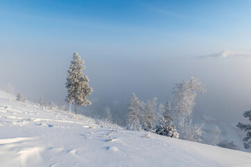 Top view of the Yakutsk city in the fog. A thick fog is formed due to the cold that collects in the lowlands - 418699720