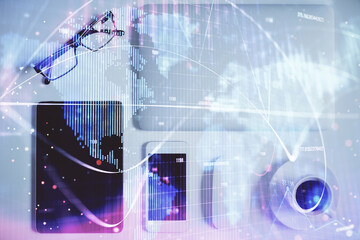 Double exposure of business theme hologram over desktop with phone. Top view. Mobile international trade connection concept.