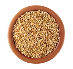 Millet seeds pile in clay pot isolated on white background, top view