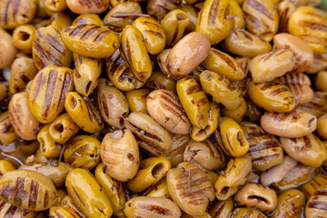 Grilled olives background of closeup at the market.