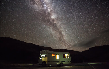 Camper Van under Milky Way in Mount Cook National Park, New Zealand. Low Light Condition with High ISO