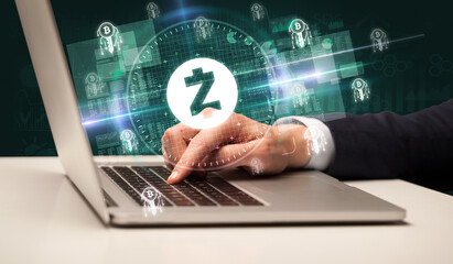 business hand working in stock market with zcash icons coming out from laptop screen