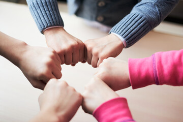 kids hands in circle together, friendship and peace concept