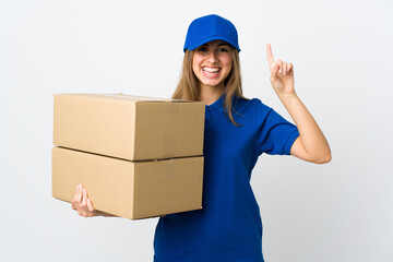 Young delivery woman over isolated white background pointing up a great idea