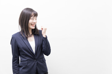 Woman raising her clenched fist  (gesture)