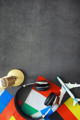 Learning foreign languages. Audio language courses. Background from countries flags and headphones on the table. © alexkich