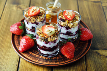 Dessert of homemade muesli, berries and yogurt