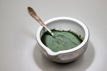 spirulina powder in bowl superfood