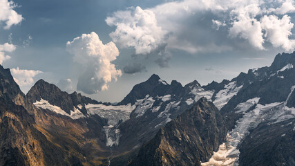 Naklejka premium Dombai at sunset. Magnificent panorama of the Caucasus Mountains in high resolution. Wallpaper.