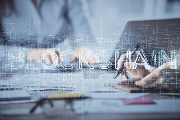 Double exposure of woman hands typing on computer and crypto market theme hologram drawing. Blockchain concept.