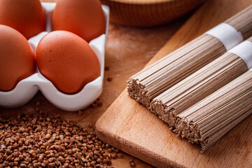 fresh natural buckwheat flour on a wooden rustic background culinary concept