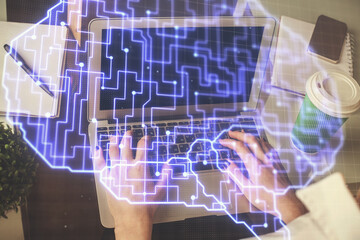 Double exposure of woman hands working on computer and brain hologram drawing. Ai concept.