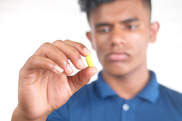  man hand holding pills with copy space 