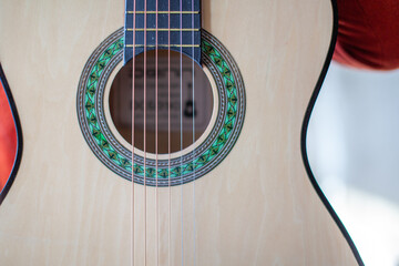 Close-up of a guitar player or a person learning to play the guitar.