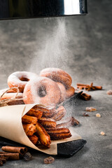 Traditional churros sticks with cinnamon sprinkling with sugar powder