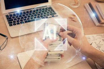 Multi exposure of technology drawing hologram and us dollars bills and man hands. Data concept